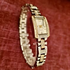 Wrist Watch for Woman, Gold and Silver Colour, Zirconia Stones, Dainty Watch, Easy Usage, Stylish Design, Charismatic Design, Rectangle Design, Pearl Design Dial, Cool Design Total Length: 20 cm Case Diameter: 27 x 16 mm Band Width: 10 mm Case Thickness: 7,5 mm Weigth: 45 gr Gold Analog Watch With Rectangular Face, Gold Rectangular Analog Watch, Gold Rectangular Analog Jewelry And Watches, Rectangular Gold Analog Watch, Elegant Rectangular Analog Jewelry And Watches, Rectangular Metal Watches With Metal Dial, Rectangular Metal Dial Watches, Rectangular Metal Watches For Gifts, Rectangular Metal Watches As Gifts