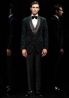 This metallic wildflower embellished tuxedo is a concept piece. Single-buttoned satin detail shawl collar with adorned edges. The tuxedo is immaculately paired with black flat-front trousers. Embroidery Details: Embroidered With Metallic Sequins, Cut Beads And Crystals. Semi-formal Satin Tuxedo Blazer, Luxury Black Satin Suit, Party Velvet Tuxedo With Suit Collar, Velvet Party Tuxedo With Suit Collar, Velvet Tuxedo With Suit Collar For Party, Black Satin Tuxedo Blazer, Fitted Tuxedo Blazer For Gala, Fitted Tuxedo Style Blazer For Gala, Luxury Velvet Tuxedo For Evening