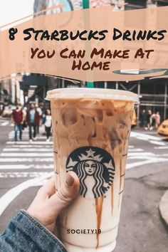 someone holding up a starbucks drink with the words 8 starbucks drinks you can make at home