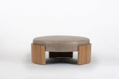 a small stool made out of wood and concrete with a seat cushion on the top