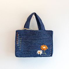 IN STOCK FAST SHIPPING FROM LOS ANGELES Get ready to tote your summer essentials in style with this handmade straw bag! Made from natural raffia, this bag features a charming daisy flower design and a large opening for easy access. The top handles make it a breeze to carry, perfect for a day at the beach or a picnic in the park. It's the ultimate combination of fashion and functionality. (Plus, it's totally handmade, so you know it's special.) Size: 9"H x 13"W x 4"D Designer Style ID: 8629 Spring Straw Top Handle Shoulder Bag, Casual Spring Straw Bag With Top Handle, Casual Top Handle Straw Bag For Spring, Spring Travel Handheld Crochet Bag, Handheld Crochet Travel Bag For Spring, Spring Handheld Beach Bag, Rectangular Straw Bag For Spring, Rectangular Woven Bags For Spring, Spring Travel Handheld Straw Bag