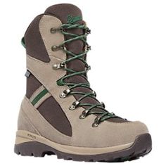 a pair of hiking boots with green laces on the outstep and toe