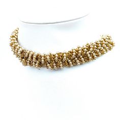 This vintage gold and pearl beaded choker necklace evokes the elegance of bygone eras. Its intricate design, featuring shimmering gold-toned beads interwoven with lustrous pearls, is reminiscent of classic jewelry styles. The adjustable clasp ensures a comfortable fit, making it a timeless addition to any jewelry collection. * Gold & pearl beads   * Adjustable clasp   * Choker style   * Intricate design 15-16" Size: Womens 15-16" Condition: Pre-Owned Good Vintage Gold Beaded Choker, Gold-tone Costume Jewelry Choker, Vintage Beaded Multi-strand Pearl Necklace, Vintage Multi-strand Pearl Necklace For Formal Occasions, Jewelry Styles, Choker Style, Beaded Choker Necklace, Accessories Jewelry Necklace, Classic Jewelry