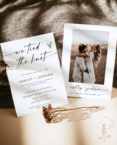 two wedding cards with the words we tied to the knot on them next to an open book