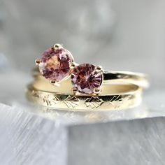 Why I Love It: I pinky promise you won't find a pair of sapphires like this! Doubly delicious with the sweetest pink hue, these round cut sapphires are secured with classic prongs as well as compass set prongs to make this toi et moi setting extra special. Finished in 14k yellow gold and sits low profile and flush to the finger. The Details: 14k Yellow Gold 1.36 Carats Total Pink Round Brilliant Cut Sapphires Stones Measures Approx. 5.55 & 5.04 mm Current Ring Size - 6.25 Band Width is Approx. 2 Fine Jewelry Pink Sapphire Ring With Brilliant Cut, Brilliant Cut Pink Sapphire Ring In Fine Jewelry Style, Brilliant Cut Pink Sapphire Ring Fine Jewelry, Pink Sapphire Ring With Brilliant Cut, Brilliant Cut Pink Sapphire Ring, Timeless Pink Ring With Prong Setting, Classic Pink Round Cut Sapphire Ring, Rose Gold Round Cut Sapphire Ring, Rose Gold Sapphire Ring With Round Cut