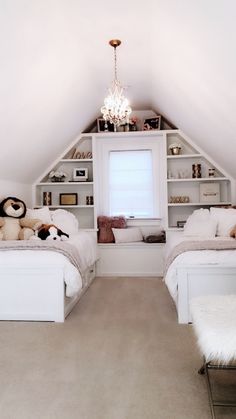 two beds in a room with white walls and carpeted flooring, built into the ceiling