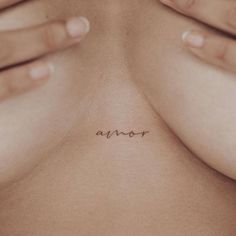 a woman's chest with the word avar written on her left side, in cursive font