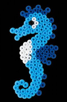 a blue and white seahorse made out of plastic beads