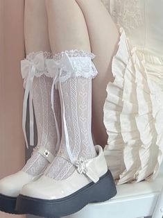 Step into a world of elegance and charm with our intricately designed socks. Featuring a delicate hollow-out pattern adorned with adorable heart motifs, these socks are the epitome of feminine grace. The cuffs are embellished with luxurious lace ruffle trim and finished with dainty bow ribbons, adding a touch of whimsy and sophistication to your outfit. Perfectly balancing style and comfort, these socks are a must-have accessory for any kawaii or lolita fashion enthusiast.  Please note, the price is for one pair of socks. Lace Ruffle Socks, Kawaii Lace Socks, Fashion Enthusiast, Kawaii Fashion Outfits