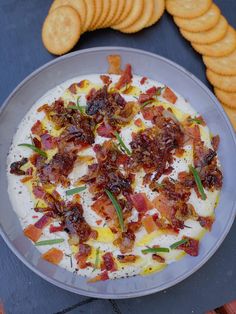 an appetizer with bacon, cheese and crackers