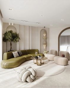 a living room filled with furniture next to a large mirror on the side of a wall