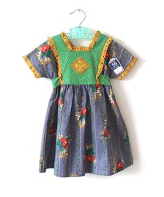 FRENCH VINTAGE 70's, stunning summer dress, long length, floral + polka dots cotton fabric, square collar, lace edgings, buttoned at the back ( flower buttons ), belt to tie. Size 2 years Length 19,6" / Waist ( taken flat ) 10,2" Size 5 years Length 25,6" / Waist ( taken flat ) 11,4" New old stock  I always refund overcharged shipping from 1 Euros overpaid ! Thank you for your visit Retro Cotton Vintage Dress With Vintage Pattern, Summer Cotton Prairie Peasant Dress, Summer Cotton Peasant Prairie Dress, Vintage Cotton Dresses For Spring, Bohemian Cotton Vintage Dress For Garden Party, Retro Lace Trim Dress For Garden Party, Summer Vintage Dress With Lace Trim, Vintage Square Neck Dress For Garden Party, Retro Dresses With Lace Trim For Garden Party