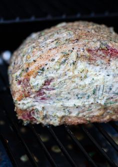 a meatloaf is cooking on an outdoor grill