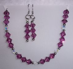 "Swarovski's Amethyst crystal bracelet and earring set! The 6mm crystals are set with 4mm aurora crystals and 3mm beads to make a beautifully patterned bracelet set. The bracelet is 7\" long with a 1\" extension chain that can be adjusted link by link, and the earrings are 1.75\" long with a 1\" drop. The beads, clasp, chain and ear wires are all stainless steel-hypoallergenic, durable and tarnish resistant. From every day to a wedding, this amethyst crystal set will be the perfect accent!" 3mm Bead Necklace, Diy Necklace Patterns, Amethyst Crystal Bracelet, Bracelet And Earring Set, Diy Jewelry Unique, Jewelry Set Design, Sparkly Jewelry, Swarovski Crystal Necklace, Set Jewelry