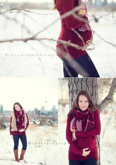 a woman standing next to a tree in the snow