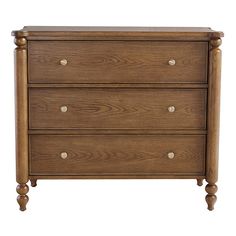 a wooden dresser with three drawers and two knobs on the front, against a white background