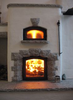 a stone oven with flames in it