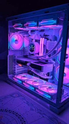 the inside of a computer case lit up with purple and blue lights