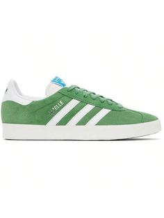 adidas Originals 
Green Gazelle Sneakers 
Low-top suede sneakers in green. 
. Perforated detailing throughout 
. Lace-up closure 
. Logo patch at padded tongue 
. Padded collar 
. Signature serrated stripes at sides 
. Text stamp at outer side 
. Logo printed at buffed leather heel tab 
. Mesh lining 
. Treaded rubber sole 
Supplier color: Preloved green/Cloud white/Core white 
Upper: leather. Sole: rubber. 
Made in Viet Nam. 
241751M237051 
Originals Green Gazelle Sneakers default         Sport Casual Athletic Shoes, Adidas Athletic Shoes, Casual Athletic, Outdoor Shoes, Suede Sneakers, Outdoor Sports, Kids Beachwear, Adidas Shoes, Leather Heels