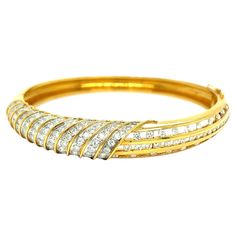 Diamond yellow gold bangle bracelet, made in Italy Very clean and white round-cut diamonds of approximately 4.5 carats, 18 karat yellow gold; marked 750, 18k Size: thickness 1 cm; inner diameters 5.5 and 5 cm; inner circumference 6.5 inches Total weight: 30.2 grams Yellow Gold Bangle, Gold Bangle Bracelet, Gold Bangle, Gold Bangles, Round Cut Diamond, Bangle Bracelet, Round Cut, Bangle Bracelets, Jewelry Bracelets