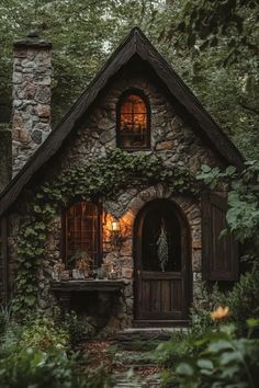 a small stone house in the woods