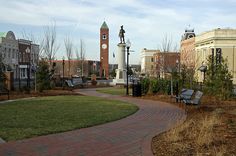 a clock tower in the middle of a park