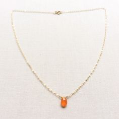 "This Carnelian necklace is made of genuine high quality faceted Carnelian. There are gold filled ,sterling silver and 14kt gold chain you can choose from. There are 2 sizes that you can choose from 16\" or 18\" in gold filled, sterling silver or 14k gold. This tiny carnelian necklace is light weight and elegant. The Carnelian jewelry stone is around 1.5 carats. This tiny carnelian necklace is great for layering with other gold necklaces. This orange stone necklace is delicate and perfect to go Orange Carnelian Gemstone Necklace, Gift Chalcedony Faceted Necklaces, Gold Carnelian Crystal Necklace As Gift, Gold Carnelian Crystal Necklace Gift, Amber Carnelian Necklace With Birthstone, Orange Carnelian Crystal Necklace As Gift, Orange Carnelian Crystal Necklace For Gift, Orange Chalcedony Jewelry For Gifts, Amber Carnelian Necklace Birthstone