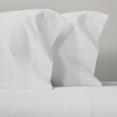 two white sheets are folded on top of each other