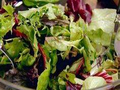 a close up of a salad in a glass bowl