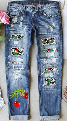 an old pair of jeans with patches and flowers