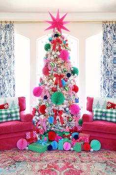 a brightly colored christmas tree in a living room