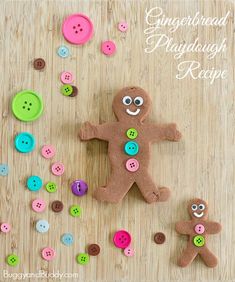 gingerbread doughnuts decorated with buttons on a wooden surface and surrounded by other decorations