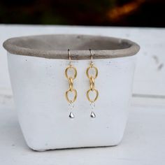 These are 10k gold plated brass chain earrings with sterling silver drops on gold filled ear wire. They hang approximately 2 inches long. (E1559) 14k Gold Filled Chain Dangle Earrings, Gold Hypoallergenic Brass Teardrop Earrings, Hypoallergenic Gold Teardrop Brass Earrings, Hypoallergenic Gold Teardrop Earrings In Brass, Gold Hypoallergenic Teardrop Chandelier Earrings, Yellow Gold Chain Brass Earrings, Gold Dangle Linear Earrings 14k Gold Filled, Gold Long Drop Teardrop Earrings For Everyday, Everyday Gold Long Drop Teardrop Earrings