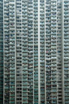 an apartment building with many balconies in the windows