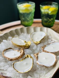 oysters on ice with lemonade in the background and two glasses of green tea