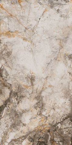 a white and brown marble textured surface with gold veining on the edges, as seen from above