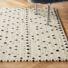 an area rug with black and white designs on it