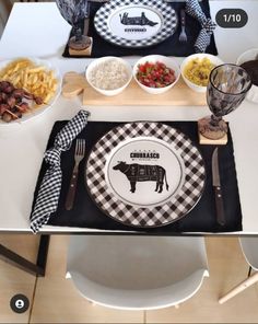 the table is set with plates, bowls and utensils for an appetizer