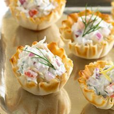 several small appetizers are sitting on a tray