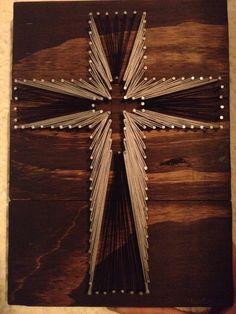 a cross made out of string and wood