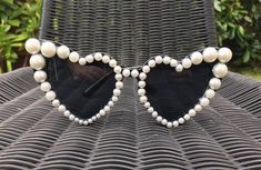 Black cat eye style heart shaped sunglasses embellished with flat back pearlsCan be done on ivory or red coloured frames. Message with any questions or custom requests. Bride Sunglasses, Bride With Glasses, Pearl Sunglasses, Bachelorette Accessories, Black Cat Eye, Stylish Eyeglasses, Shaped Sunglasses, Heart Shaped Sunglasses, Black Cat Eyes