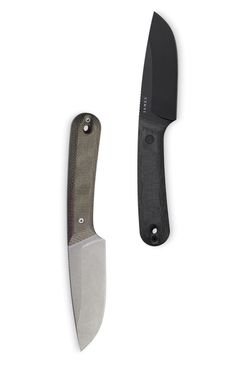 a knife with a black handle next to it