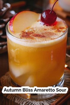 an autumn bliss amaretto sour cocktail with a cherry garnish on the rim