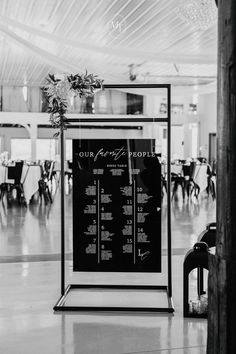 a black and white photo of a seating chart in a banquet hall with tables set up for an event