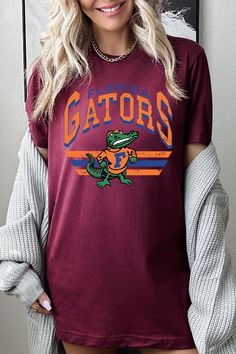 FLORIDA GATORS,FOOTBALL UNISEX SHORT SLEEVE,GRAPHIC TEE,GRAPHIC TSHIRTS,TSHIRTS,TEES100%COTTON,HEATHER(52%COTTON,48%POLY),ATH.HEATHER,BLACK HEATHER(90%COTTON,573%POLY)NICARAGUAMade In: Nicaragua Florida Gators Football, Gators Football, Essential Oil Accessories, Plus Swimwear, Florida Gators, Skirted Swimwear, Unisex Shorts, Heather Black, Nicaragua