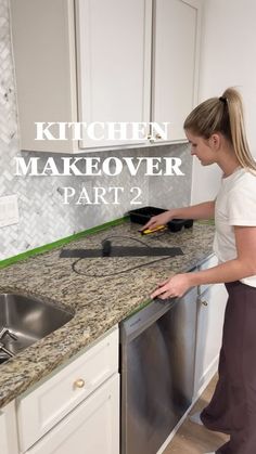 a woman standing in front of a kitchen sink with the words kitchen makeover part 2 on it