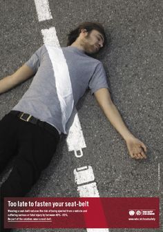 a man laying on the ground with his head down and arms spread out in front of him