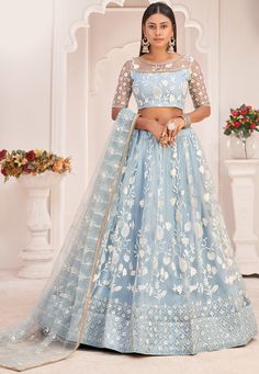 Net Lehenga in Sky Blue This Attire with Poly Shantoon Faux Crepe and Cancan is Beautifully Enhanced with Resham, Zari, Sequins and Patch Border Work Available with an Semi-Stitched Net Choli and a Net Dupatta in Sky Blue, Crafted in Round Neck and Half Sleeve The Semi-stitched Lehenga Waist and Hips are Customizable from 28 to 38 and 36 to 46 inches respectively and Its Length is 42 inches Do note: Accessories shown in the image are for presentation purposes only.(Slight variation in actual col Sky Blue Lehenga, Sky Blue Weddings, Lehenga Choli Designs, Lehenga Choli Wedding, Bollywood Lehenga, Net Lehenga, Lehenga Choli Online, Choli Designs