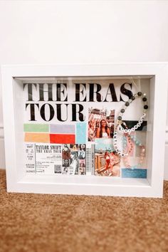 a white frame with the words the eras tour written on it and photos in them