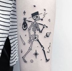 a woman with a skeleton tattoo on her arm